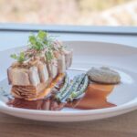 Tokara Crispy pork belly with apple and radish slaw, green beans, sesame and purée in a rich jus at Tokara, Stellenbosch