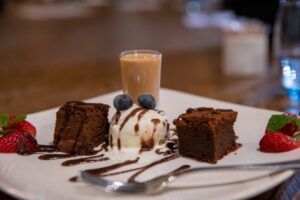 a white plate topped with cake and ice cream.