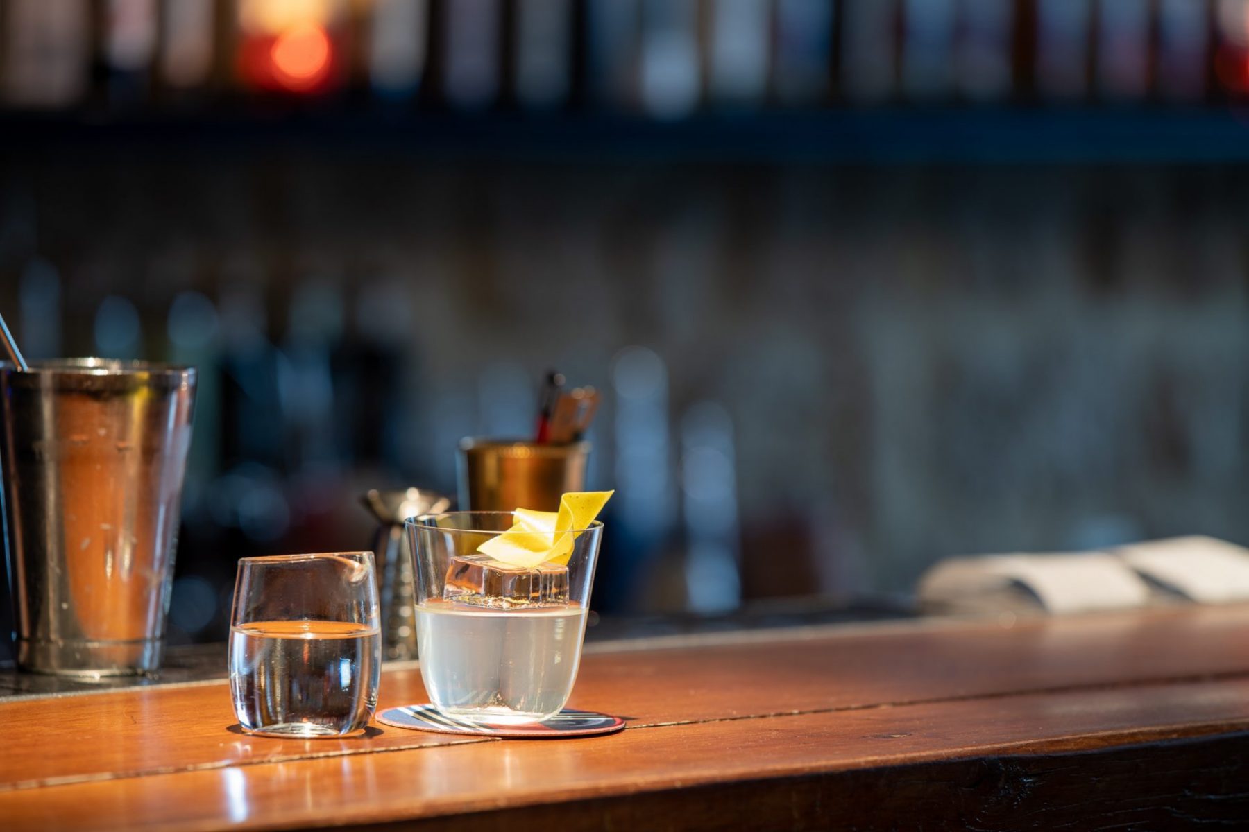 A bar with shot glasses at Little Red Door Paris.