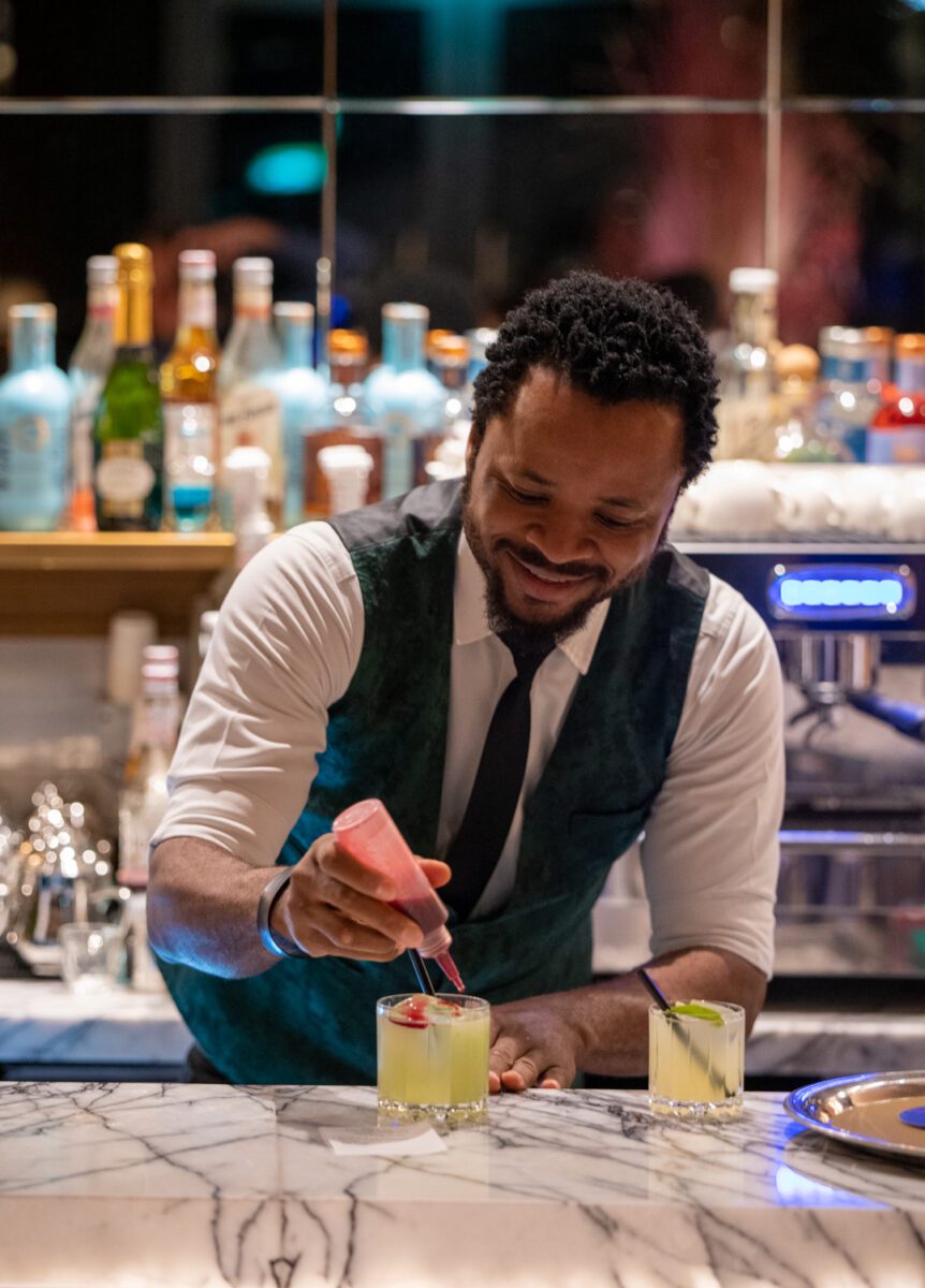 A man making a drink at RSVP Dubai.