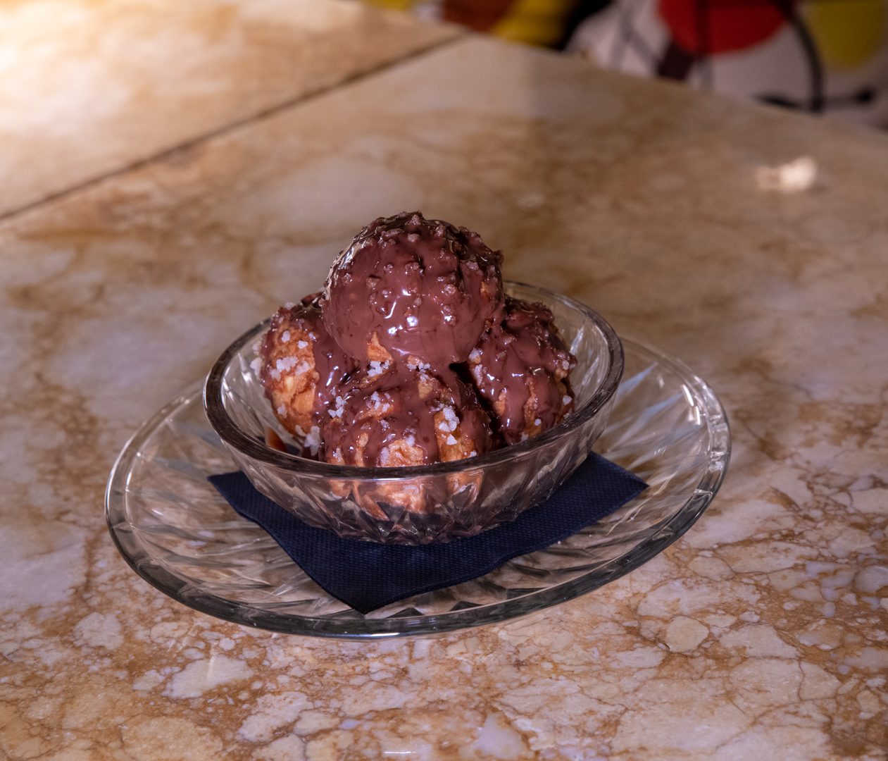 a bowl of ice cream sitting on top of a table.