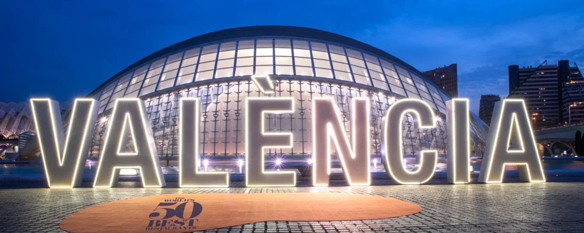 Top 7 things to do in Vivacious Valencia The word valencia is lit up in front of a building.