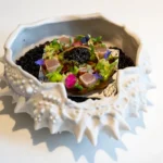 Top 15 incredible dishes of 2023 2023 - A white bowl with a fish in it.