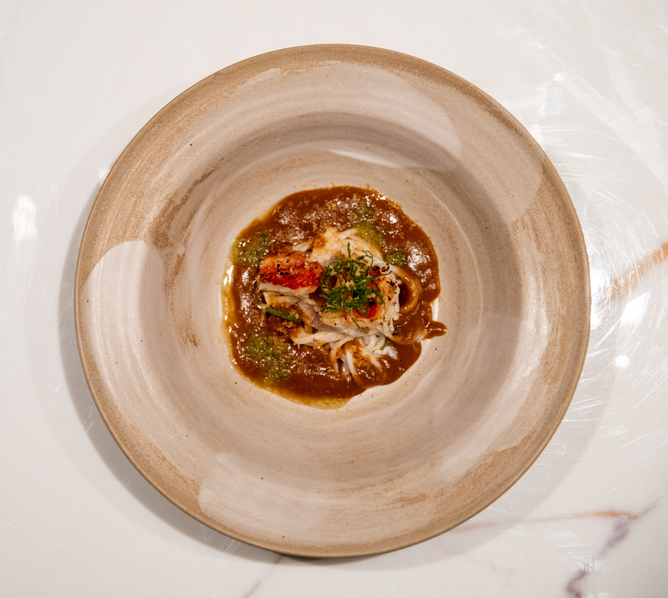 Chefs artful plating at Manao Dubai