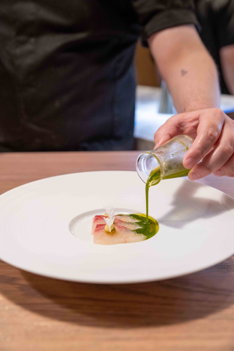 Chef Solemann Haddad preparing a course at Moonrise rooftop Dubai