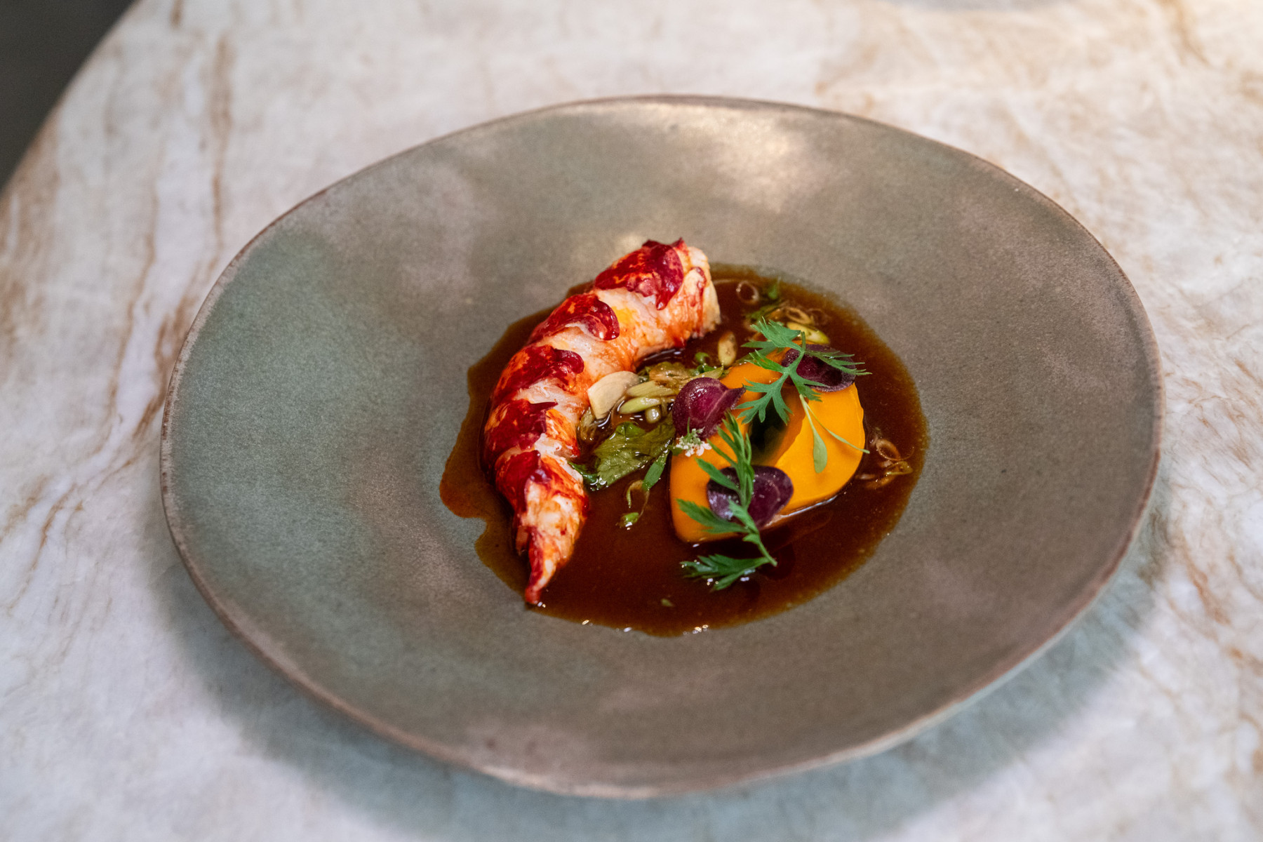Impressive wine collection displayed in Marsan dining room interior Paris