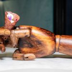 Epoka restaurant dish served on a decorative wooden hand