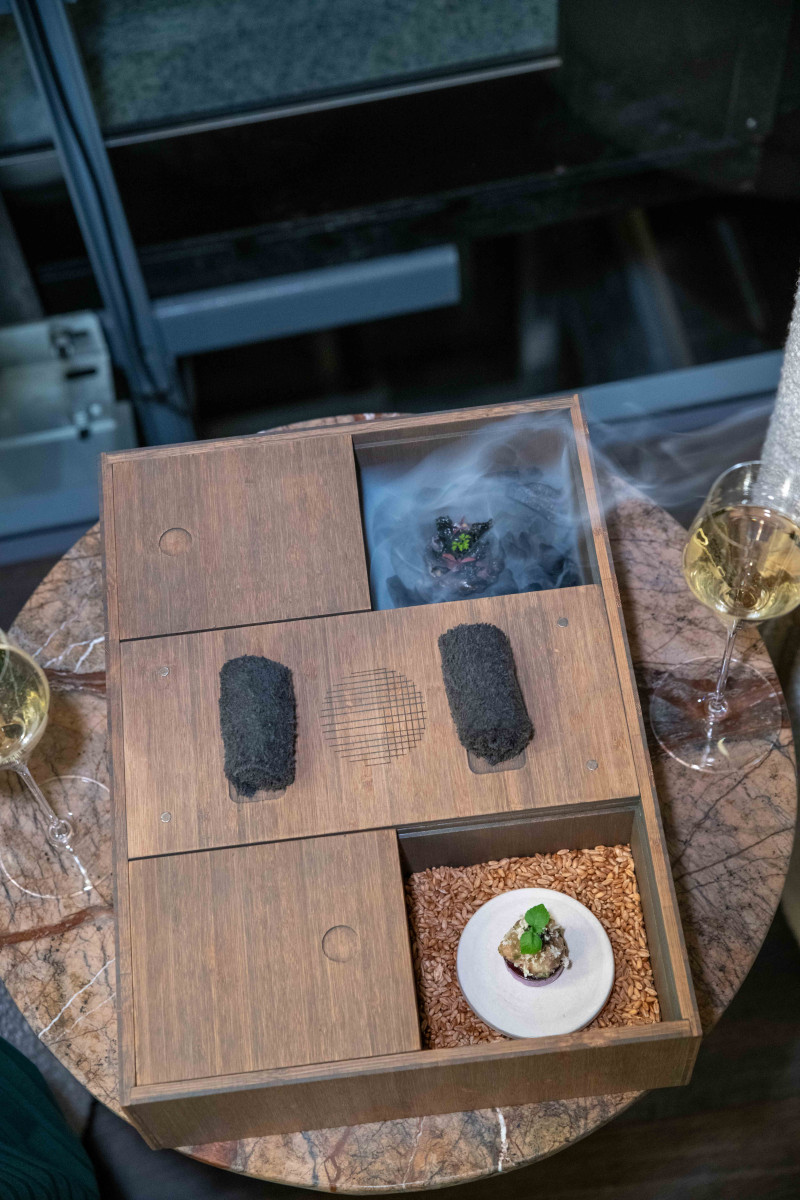 Deep brown and gold decor in Mertia restaurant's romantic dining room