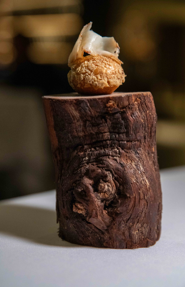 Moody candlelit dining room interior at Mertia restaurant, Stellenbosch